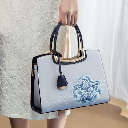 🎁Säästä jopa [40%] pois!👜Naisten tyylikäs käsilaukku, jossa on pioni-kirjonta