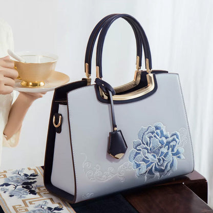 🎁Säästä jopa [40%] pois!👜Naisten tyylikäs käsilaukku, jossa on pioni-kirjonta