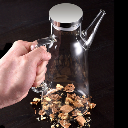 Öljyn annostelupullo, jossa on tippumaton nokka